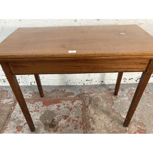 138 - A 19th century inlaid mahogany fold over tea table - approx. 75cm high x 91cm wide x 45cm deep when ... 