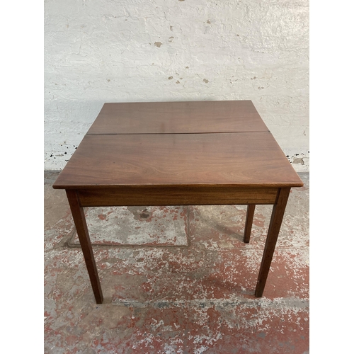 138 - A 19th century inlaid mahogany fold over tea table - approx. 75cm high x 91cm wide x 45cm deep when ... 