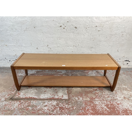 143 - A mid 20th century teak rectangular two tier coffee table - approx. 42cm high x 44cm wide x 134cm lo... 