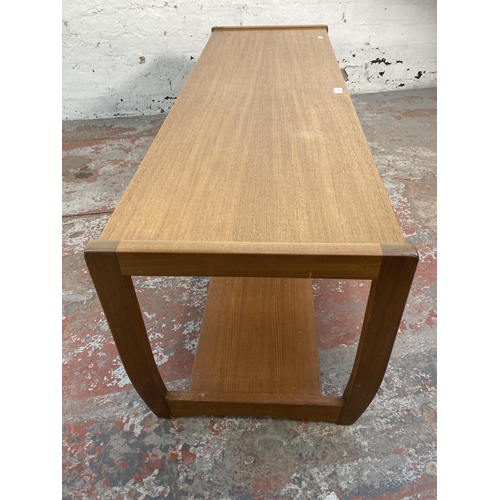 143 - A mid 20th century teak rectangular two tier coffee table - approx. 42cm high x 44cm wide x 134cm lo... 