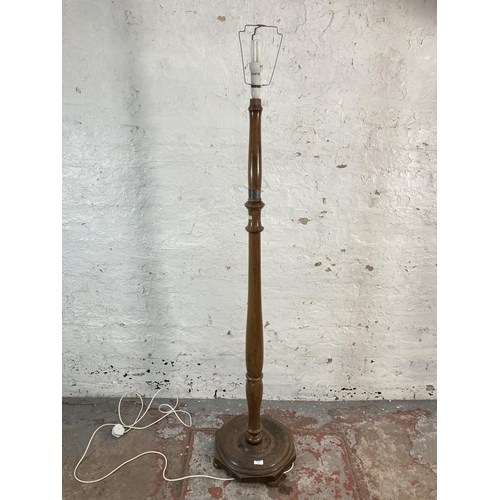 144 - A 1930s stained beech standard lamp with presentation plaque - approx. 153cm high