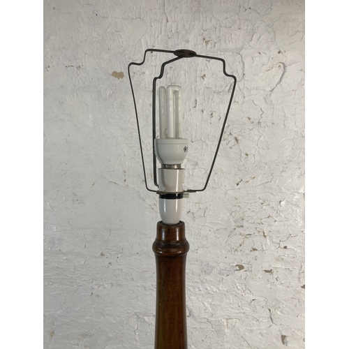 144 - A 1930s stained beech standard lamp with presentation plaque - approx. 153cm high