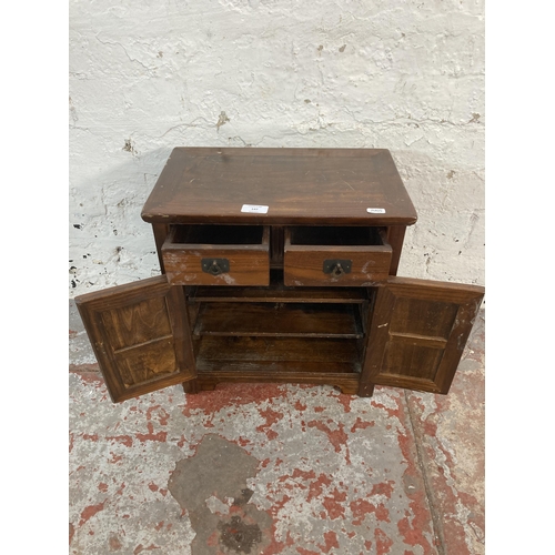 147 - An Oriental elm miniature cabinet - approx. 42cm high x 39.5cm wide x 25cm deep