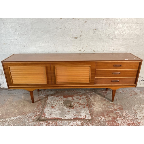 149 - A mid 20th century teak sideboard - approx. 74cm high x 199cm wide x 40cm deep