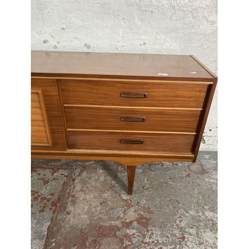 149 - A mid 20th century teak sideboard - approx. 74cm high x 199cm wide x 40cm deep