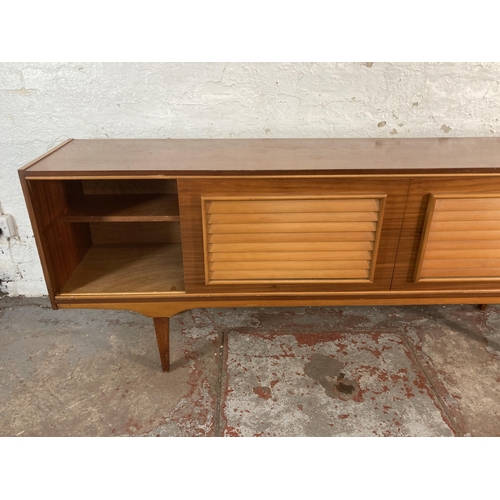 149 - A mid 20th century teak sideboard - approx. 74cm high x 199cm wide x 40cm deep