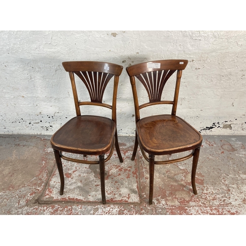 150 - A pair of early 20th century Thonet style bentwood bistro chairs with floral embossed seats