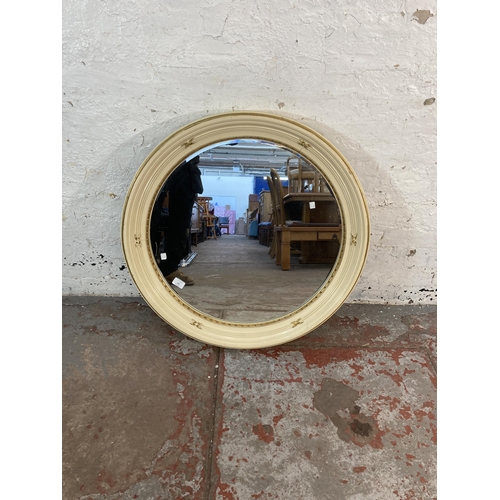 153 - A French Louis XV style white and gold painted circular bevelled edge wall mirror - approx. 77cm dim... 