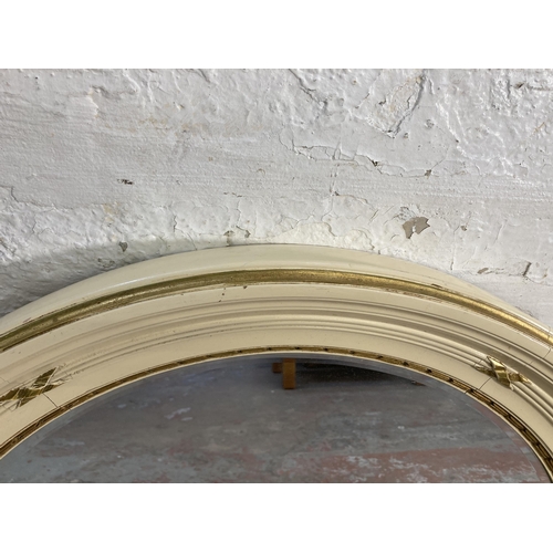 153 - A French Louis XV style white and gold painted circular bevelled edge wall mirror - approx. 77cm dim... 