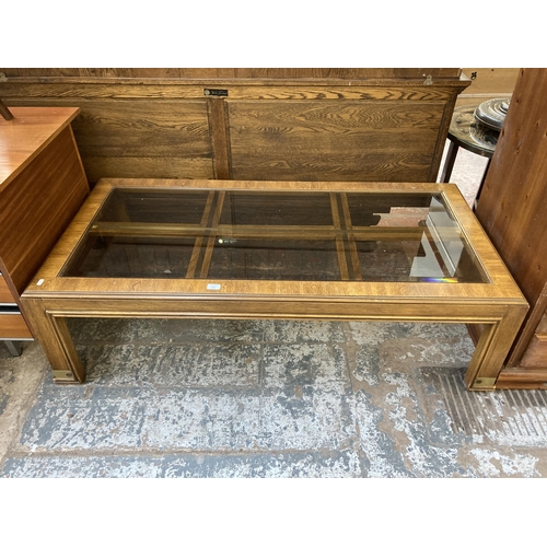 154 - A mid/late 20th century oak and bevelled glass rectangular coffee table - approx. 42cm high x 73cm w... 