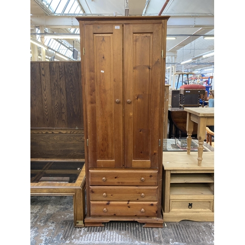 155 - A modern pine double wardrobe - approx. 189cm high x 76cm wide x 57cm deep