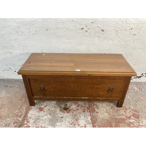 158 - An early 20th century oak wardrobe base with pine top