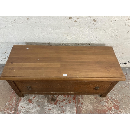 158 - An early 20th century oak wardrobe base with pine top