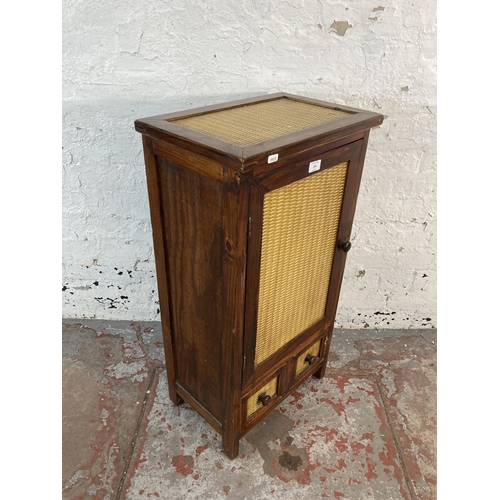 159 - A modern hardwood and wicker effect single door cabinet - approx. 85cm high x 42cm wide x 28cm deep