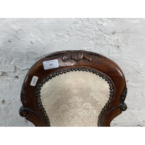 161 - A Victorian style carved mahogany and floral fabric upholstered doll’s spoon back armchair - approx.... 