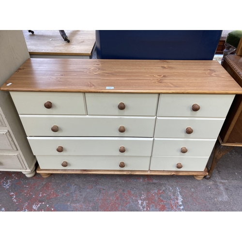 163 - A modern pine and cream painted chest of drawers - approx. 75cm high x 120cm wide x 38cm deep