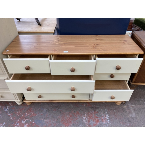 163 - A modern pine and cream painted chest of drawers - approx. 75cm high x 120cm wide x 38cm deep