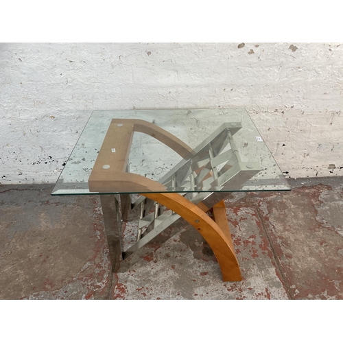 169 - A modern chrome plated and beech side table with glass top - approx. 55cm high x 61cm wide x 71cm lo... 