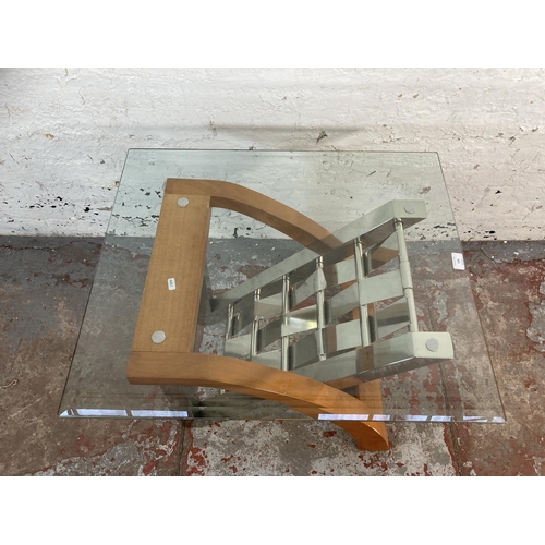 169 - A modern chrome plated and beech side table with glass top - approx. 55cm high x 61cm wide x 71cm lo... 