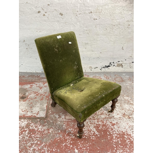 170 - A Victorian green fabric upholstered bedroom chair on mahogany supports and ceramic castors