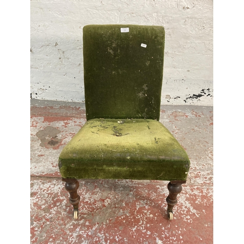 170 - A Victorian green fabric upholstered bedroom chair on mahogany supports and ceramic castors