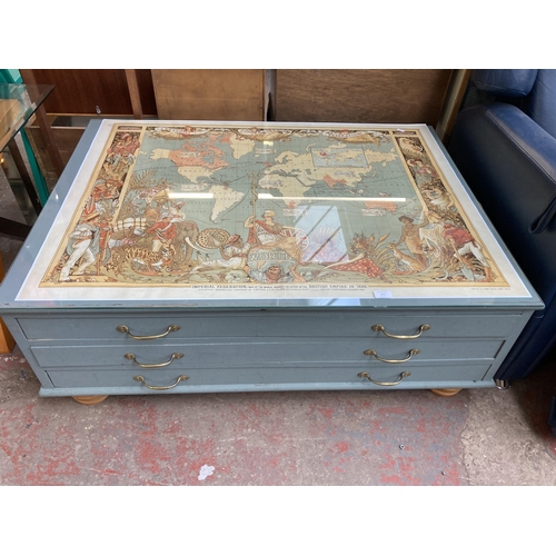 171 - A mid 20th century grey painted pine three drawer plan chest/coffee table with map of the world desi... 