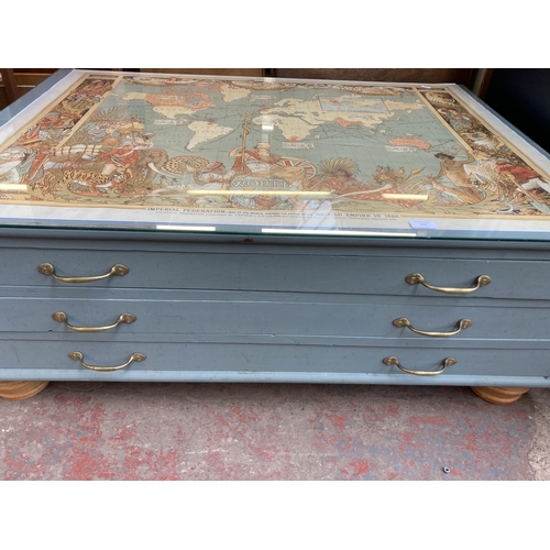 171 - A mid 20th century grey painted pine three drawer plan chest/coffee table with map of the world desi... 