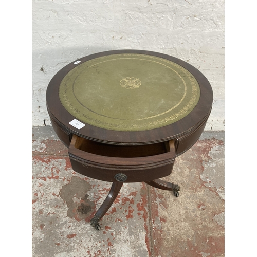 173 - A Regency style mahogany and green leather drum table - approx. 60cm high x 51cm diameter