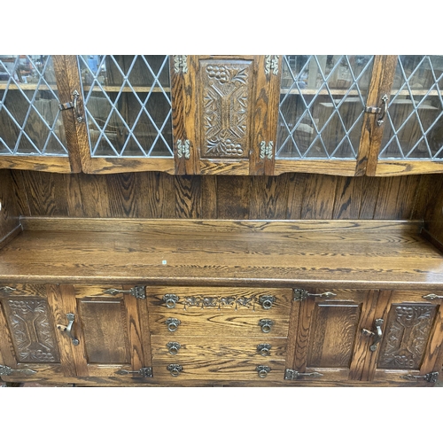 181 - A Webber Furniture carved oak dresser - approx. 163cm high x 187cm wide x 43cm deep