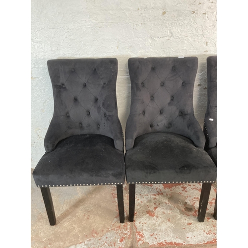 185 - Four modern upholstered button back dining chairs