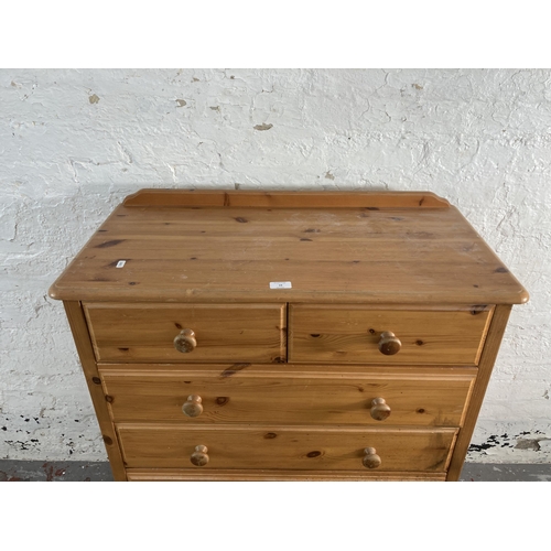 19 - A pine chest of drawers - approx. 109cm high x 85cm wide x 41cm deep