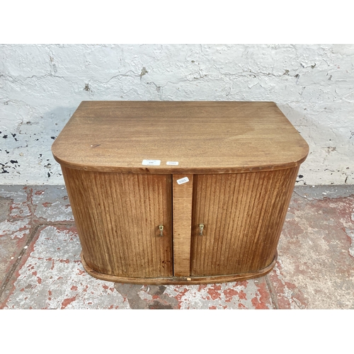 199 - A mid 20th century teak tambour door record cabinet - approx. 39cm high x 60cm wide x 39cm deep