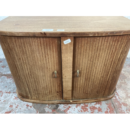 199 - A mid 20th century teak tambour door record cabinet - approx. 39cm high x 60cm wide x 39cm deep