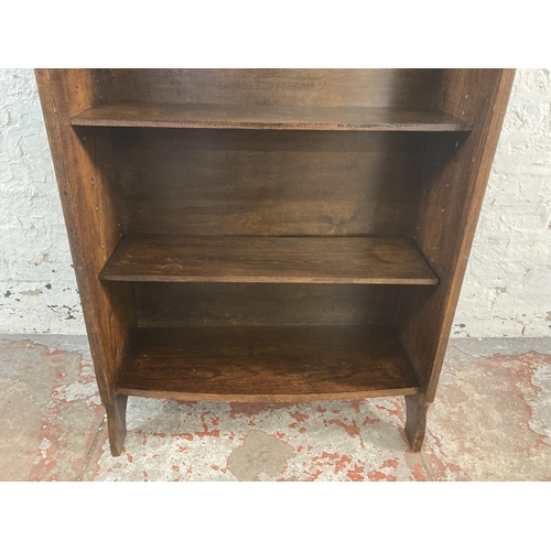 20 - An early 20th century oak four tier bookcase with beaded decoration - approx. 115cm high x 69cm wide... 