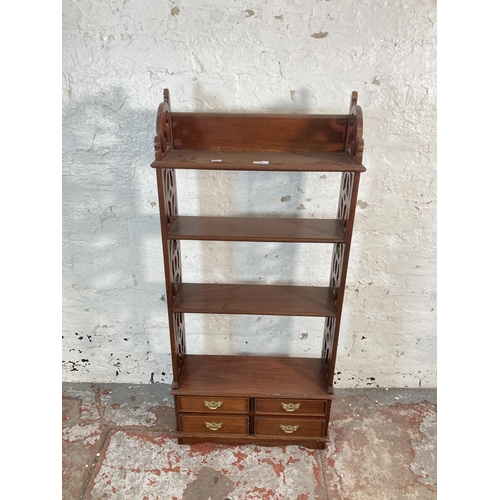 203 - A Georgian style mahogany four tier bookshelf with carved fretwork sides - approx. 112cm high x 50cm... 