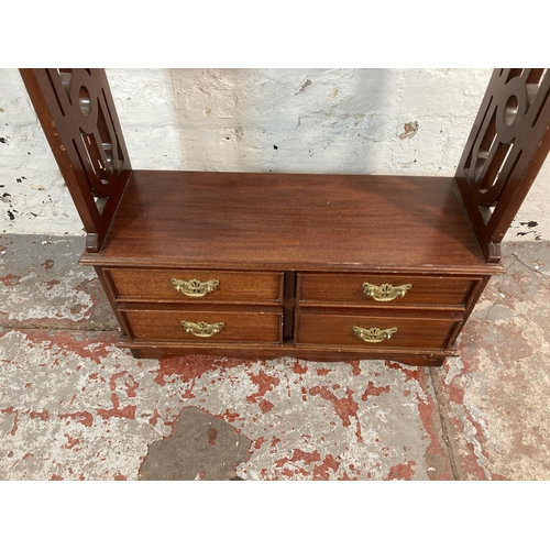 203 - A Georgian style mahogany four tier bookshelf with carved fretwork sides - approx. 112cm high x 50cm... 