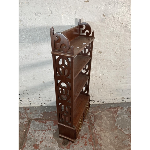 203 - A Georgian style mahogany four tier bookshelf with carved fretwork sides - approx. 112cm high x 50cm... 