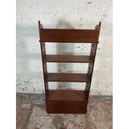 203 - A Georgian style mahogany four tier bookshelf with carved fretwork sides - approx. 112cm high x 50cm... 