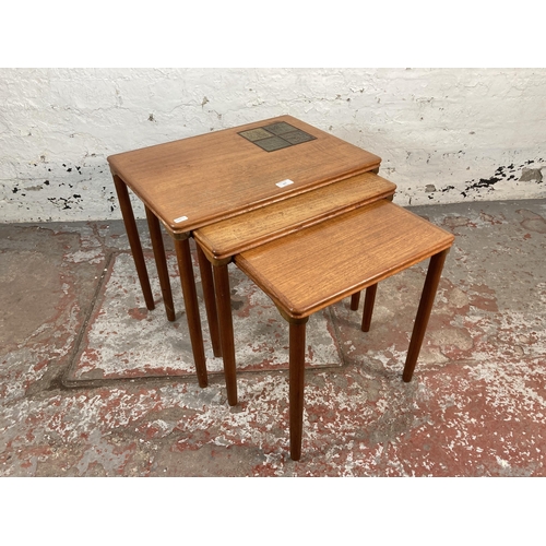 205 - A mid 20th century Danish teak nest of tables with ceramic tile inserts - approx. 50cm high x 55cm w... 