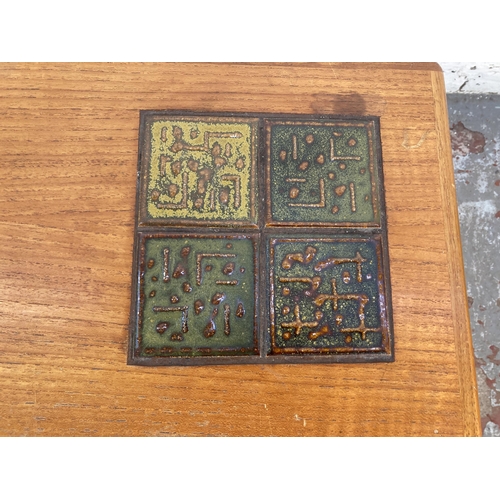 205 - A mid 20th century Danish teak nest of tables with ceramic tile inserts - approx. 50cm high x 55cm w... 