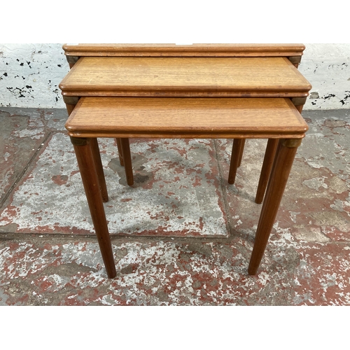 205 - A mid 20th century Danish teak nest of tables with ceramic tile inserts - approx. 50cm high x 55cm w... 