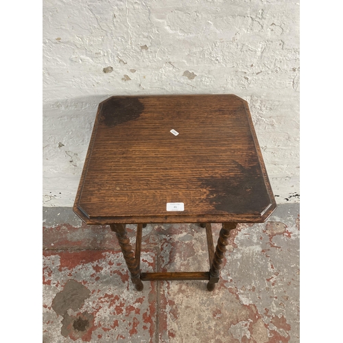 21 - An early 20th century oak barley twist side table - approx. 73cm high x 45cm wide