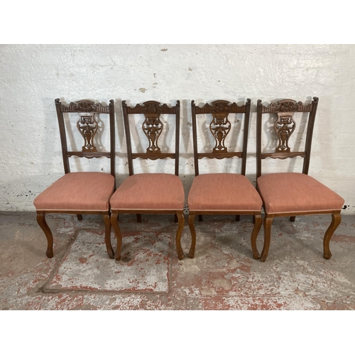 211 - Four Edwardian carved mahogany and fabric upholstered dining chairs