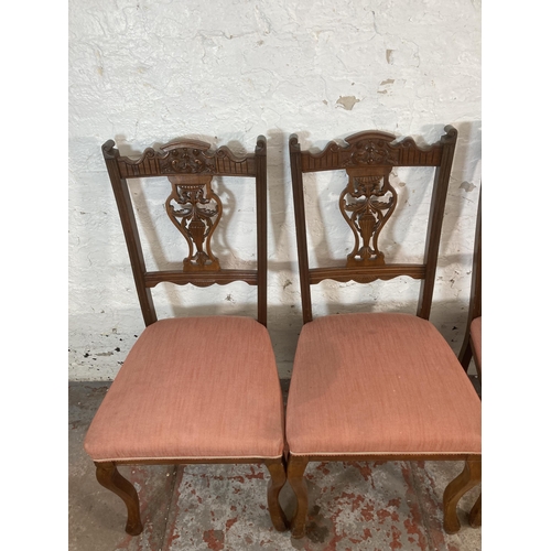 211 - Four Edwardian carved mahogany and fabric upholstered dining chairs