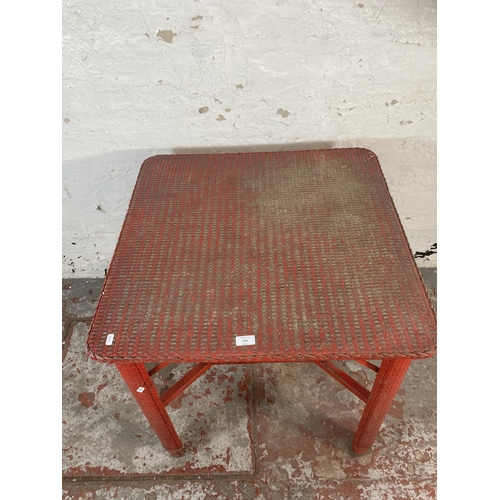 214 - A mid 20th century Lloyd Loom red painted square table - approx. 68cm high x 71cm square