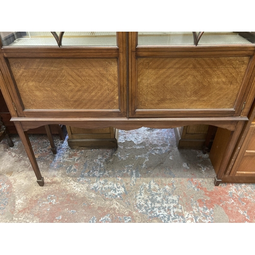 22 - An Edwardian inlaid mahogany display cabinet with two glazed doors - approx. 182cm high x 119cm wide... 