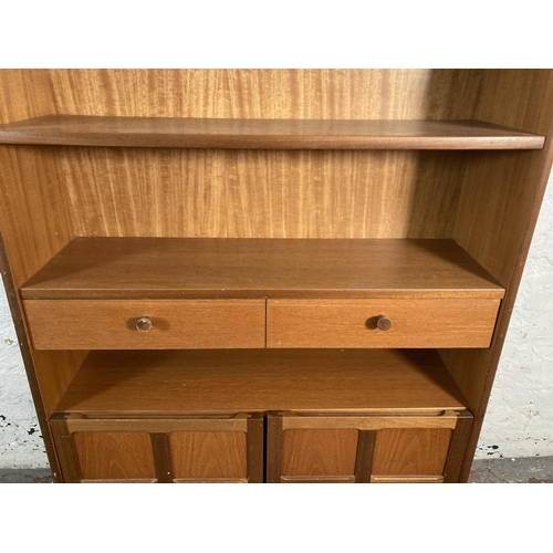 23 - A mid 20th century Nathan teak bookcase - approx. 123cm high x 87cm wide x 27cm deep