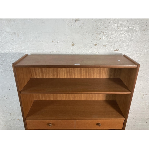 23 - A mid 20th century Nathan teak bookcase - approx. 123cm high x 87cm wide x 27cm deep