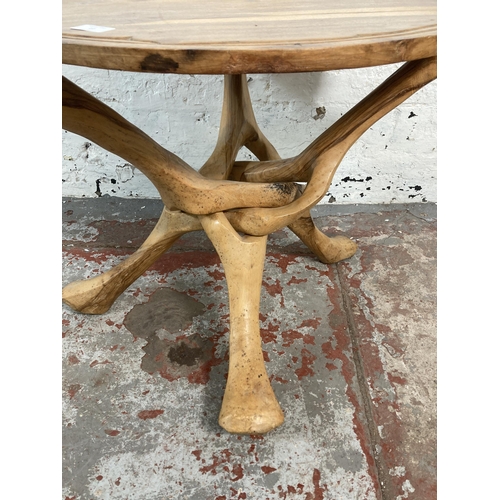 27 - A tree root circular top tripod side table - approx. 53cm high x 61cm diameter