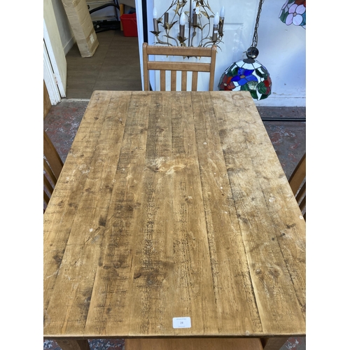 28 - A pine rectangular dining table and four beech dining chairs